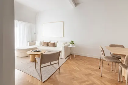 Living comedor escandinavo, luminoso y minimalista con muebles de madera y tela — proyecto AS, por Estudio Basa, en Buenos Aires