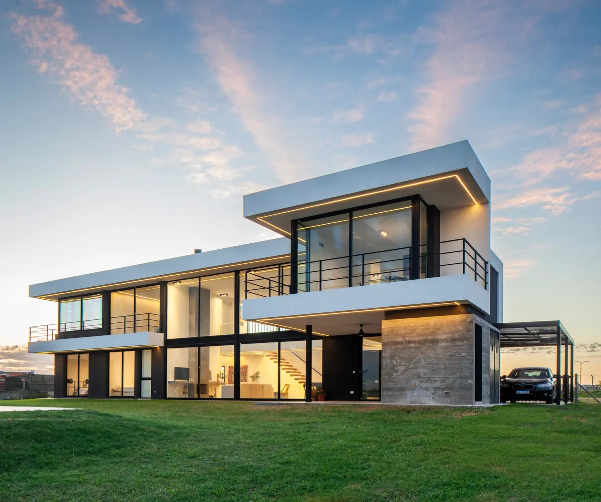 Casa moderna con amplios ventanales y detalles en hormigón — proyecto SS A7, Pilar, por ZUID PORT, en Pilar