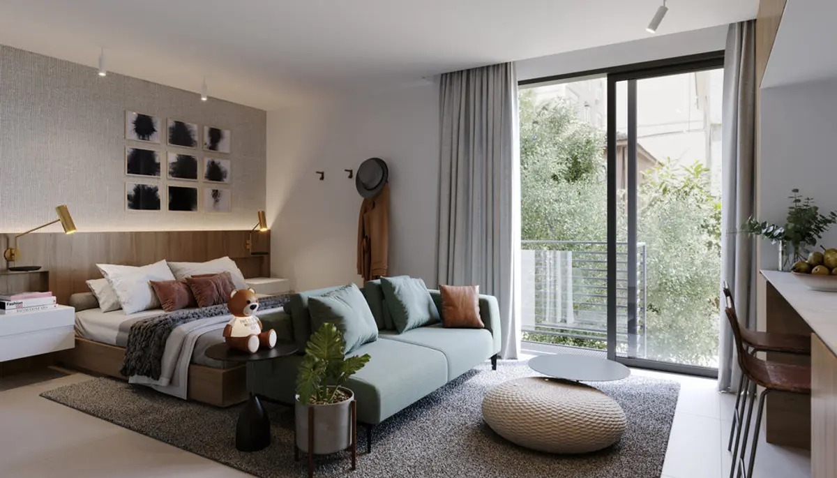Dormitorio moderno con cama tapizada, sofá y balcón con vista a jardín — proyecto Bossa 107 -BAIT, por Studio Ro-ca