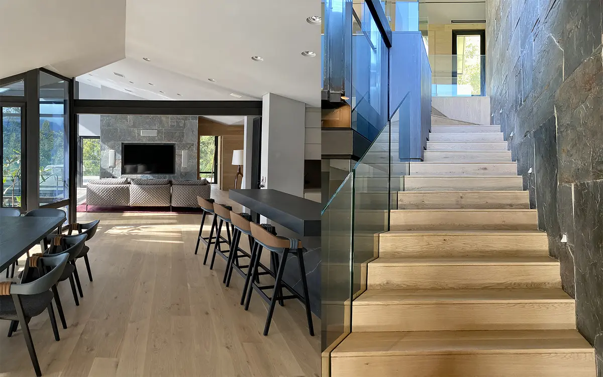 Escada flutuante moderna em interior de pé-direito duplo com vista para montanha — projeto Angostura 23, por Marcelo Lucini Studio
